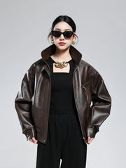 Women wearing brown PU leather jacket with turn-down collar and zipper closure, styled in vintage retro fashion