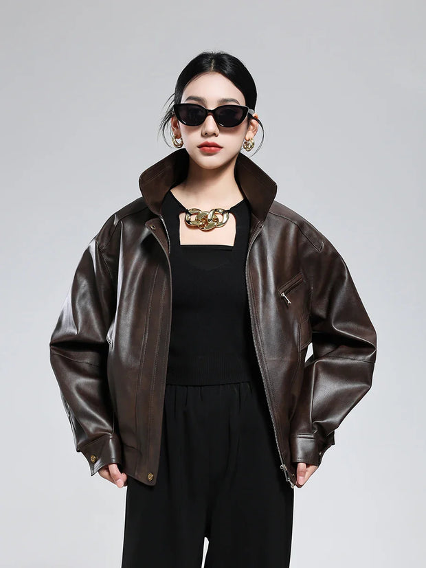 Women wearing brown PU leather jacket with turn-down collar and zipper closure, styled in vintage retro fashion