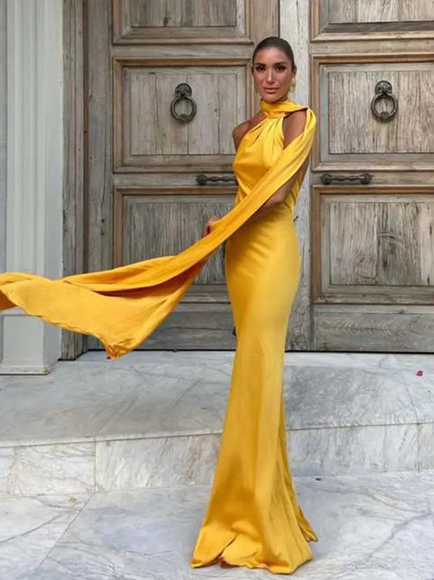 yellow halter neck sleeveless backless slim fit maxi dress with flowing fabric detail