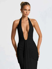woman wearing classic solid black low neck backless sheath long dress with ribbons