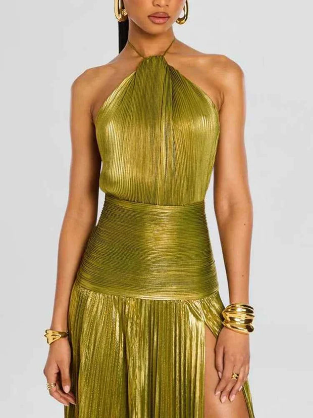 Sleeveless backless halter neck evening dress in metallic green with pleated maxi A-line skirt and empire waist