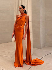 woman wearing orange halter backless off shoulder sleeveless ankle-length gown with diagonal collar and slim fit