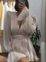 woman wearing long sleeves ribbon vestidos elegant summer evening dress with v-neck and cinched waist in light fabric