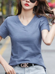 Woman wearing solid cotton V-neck casual short sleeve T-shirt in blue