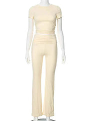 Women’s beige crop top and low rise flare leggings yoga pants set activewear with slim fit and medium stretch polyester cotton fabric