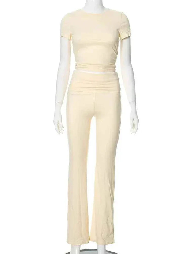 Women’s beige crop top and low rise flare leggings yoga pants set activewear with slim fit and medium stretch polyester cotton fabric