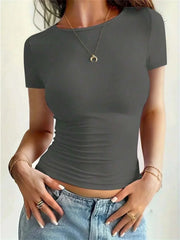 Women wearing solid gray summer fashion tee with short sleeves and round neck paired with denim jeans