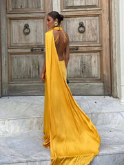 Yellow halter neck sleeveless backless maxi dress with flowing train