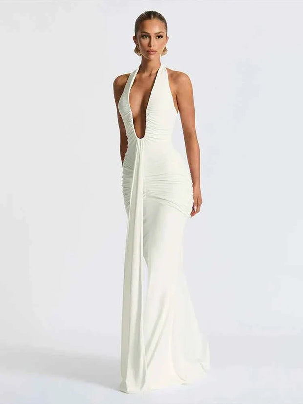 Woman wearing classic solid low neck backless white sheath long dress with ribbon detail