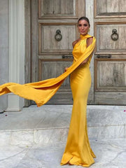woman wearing yellow halter backless off shoulder sleeveless ankle-length slim fit dress standing outdoors