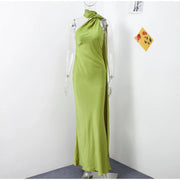 green halter neckline sleeveless backless slim fit floor-length maxi dress on mannequin
