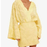 Chic fashion female yellow long sleeve V-neck bodycon mini dress with textured fabric and loose sleeves
