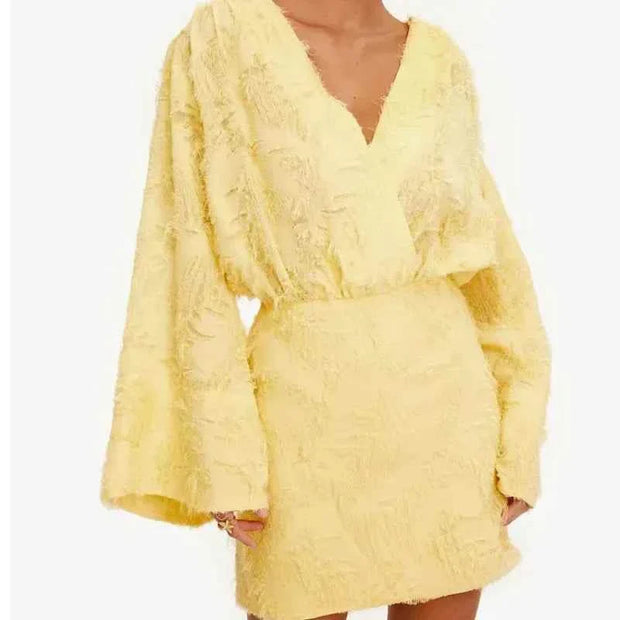 Chic fashion female yellow long sleeve V-neck bodycon mini dress with textured fabric and loose sleeves