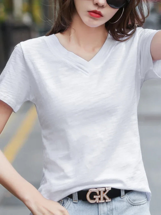 Woman wearing white solid cotton V-neck casual short sleeve T-shirt
