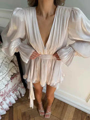 woman wearing white long sleeves ribbon vestidos with deep v-neck and ruched waist summer dress