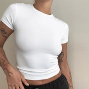 Women wearing solid white short sleeve summer fashion tee with slim fit and O-neck collar